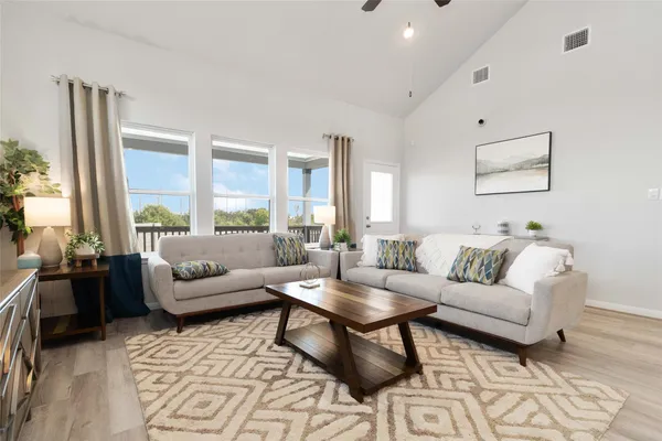 a large kitchen with stainless steel appliances granite countertop a sink a stove a washer and dryer