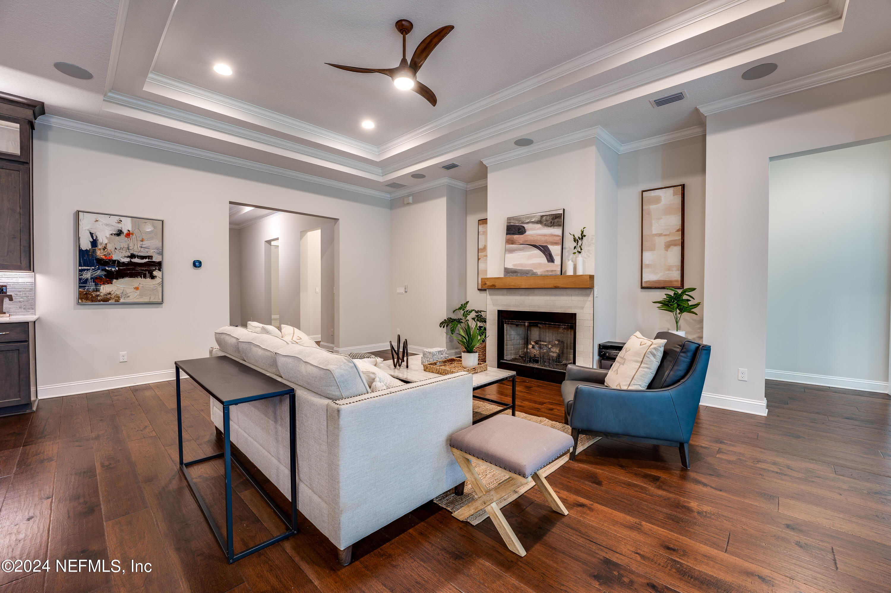 257 Glenneyre Circle St. Augustine, FL 32092 - Photo 12 of 98 a living room with furniture and a fireplace