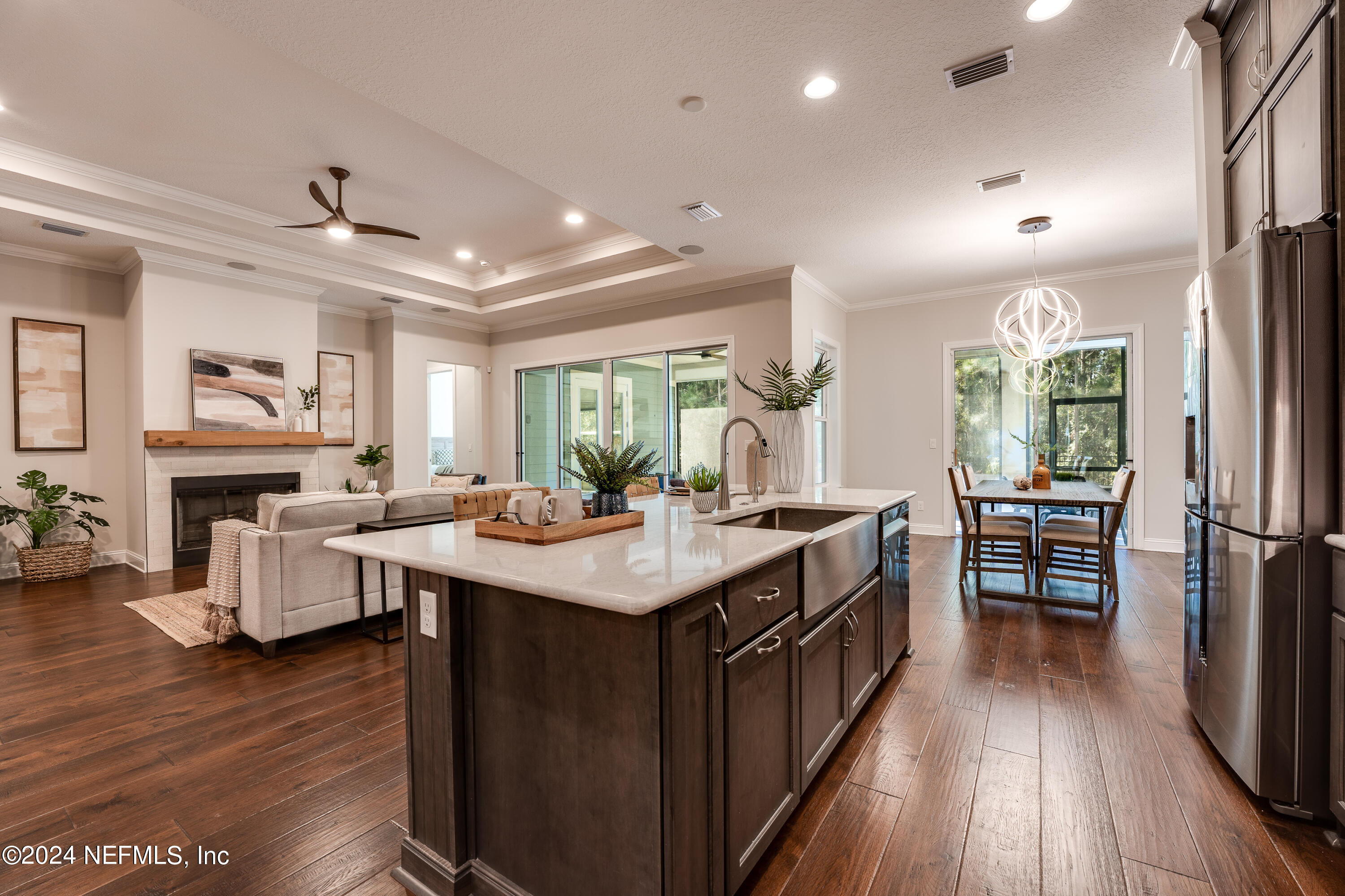257 Glenneyre Circle St. Augustine, FL 32092 - Photo 18 of 98 a kitchen with counter top space a sink appliances and wooden floor
