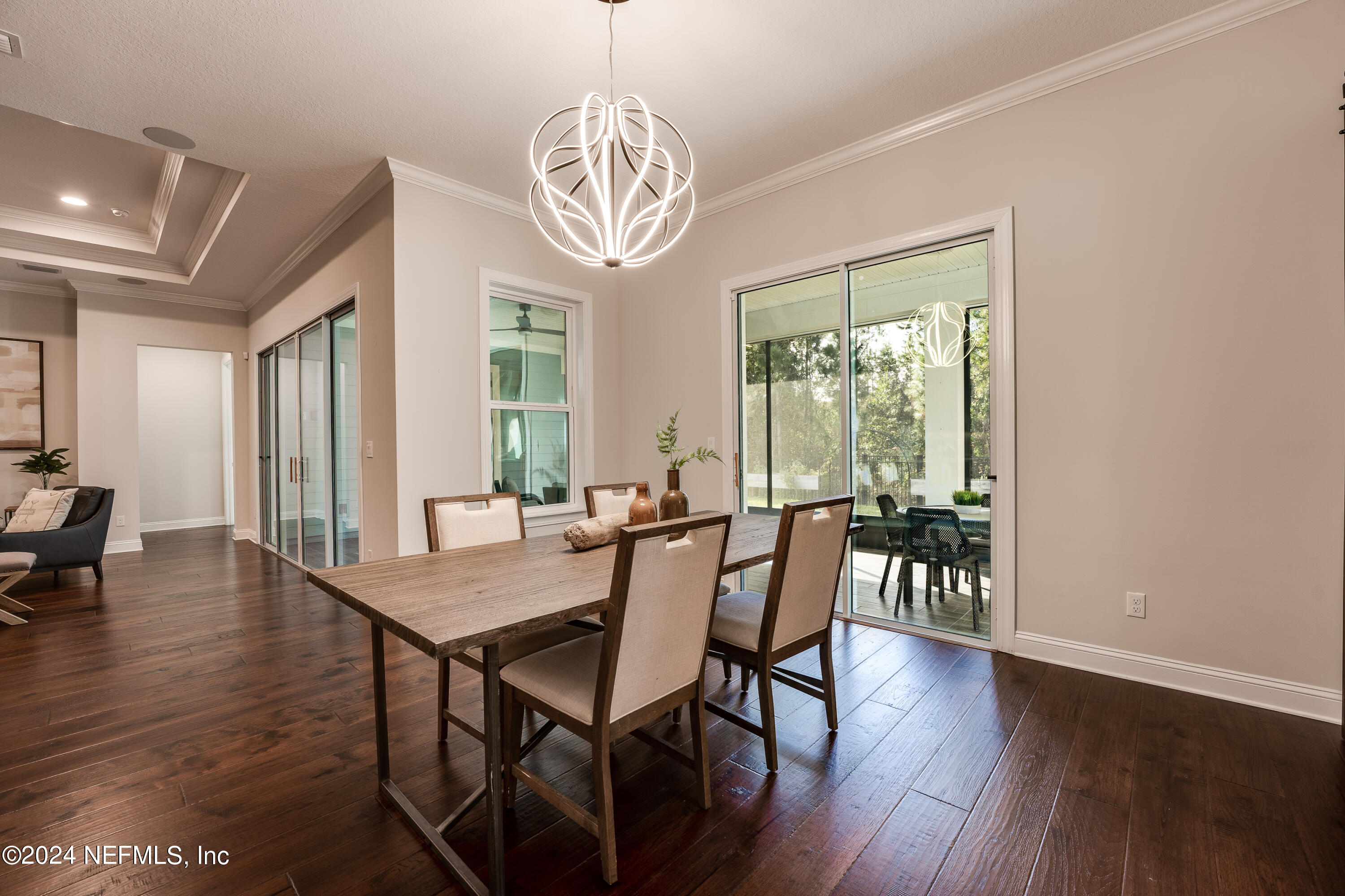 257 Glenneyre Circle St. Augustine, FL 32092 - Photo 20 of 98 a view of a dining room with furniture window and wooden floor