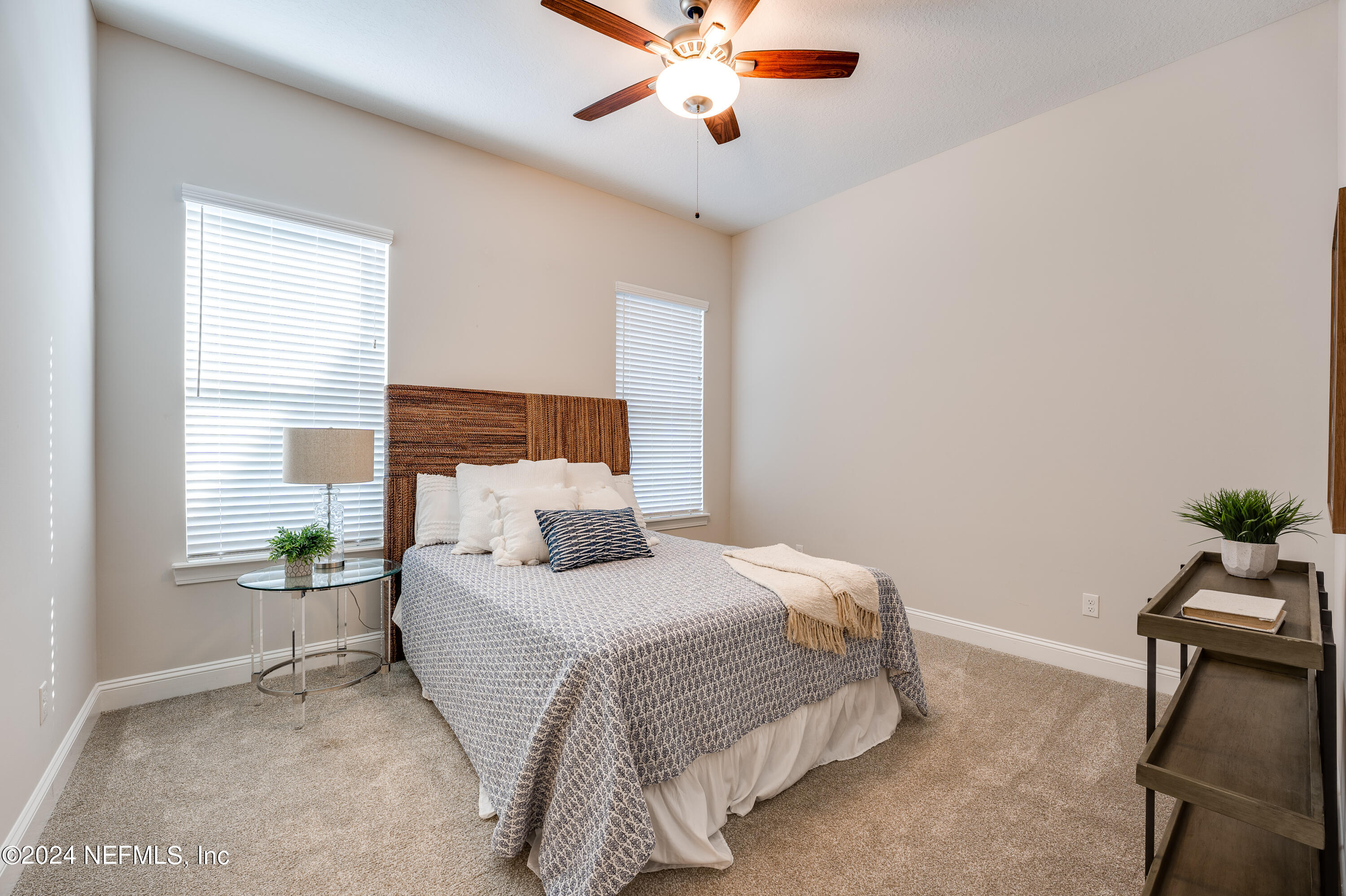 257 Glenneyre Circle St. Augustine, FL 32092 - Photo 35 of 98 a bedroom with a bed and window