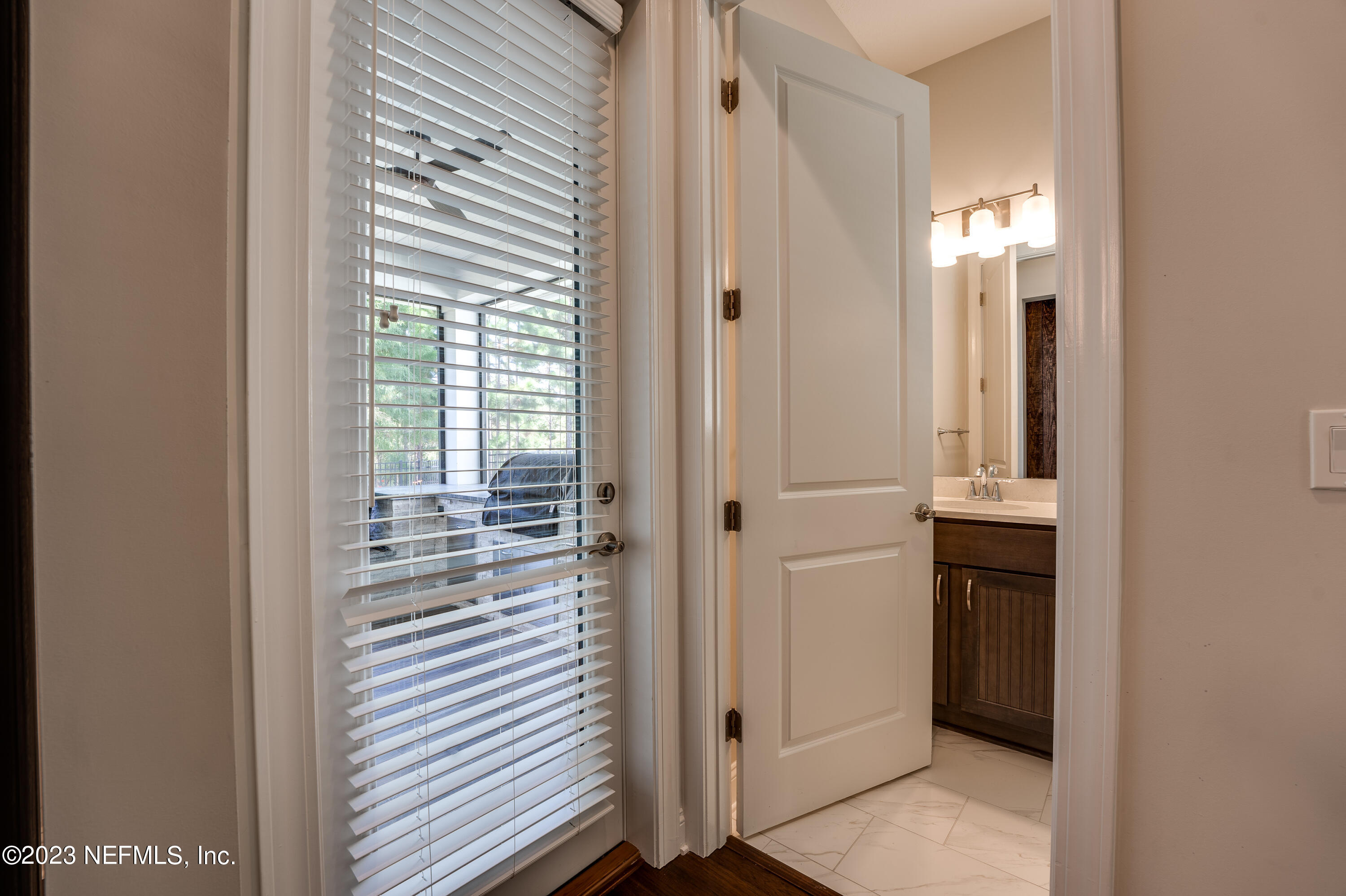 257 Glenneyre Circle St. Augustine, FL 32092 - Photo 40 of 98 a view of a hallway with closet and a window