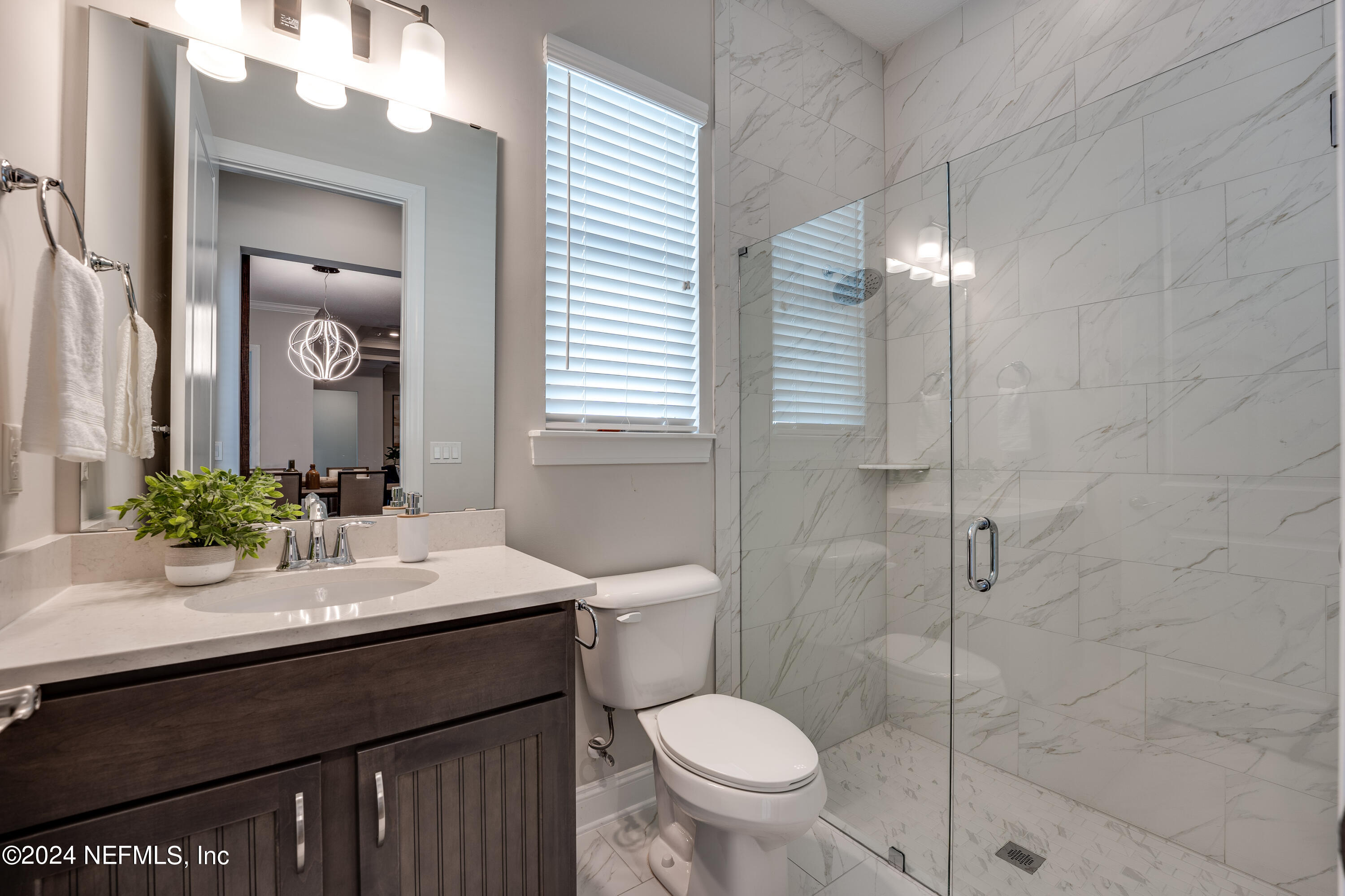 257 Glenneyre Circle St. Augustine, FL 32092 - Photo 41 of 98 a bathroom with a sink a toilet and shower