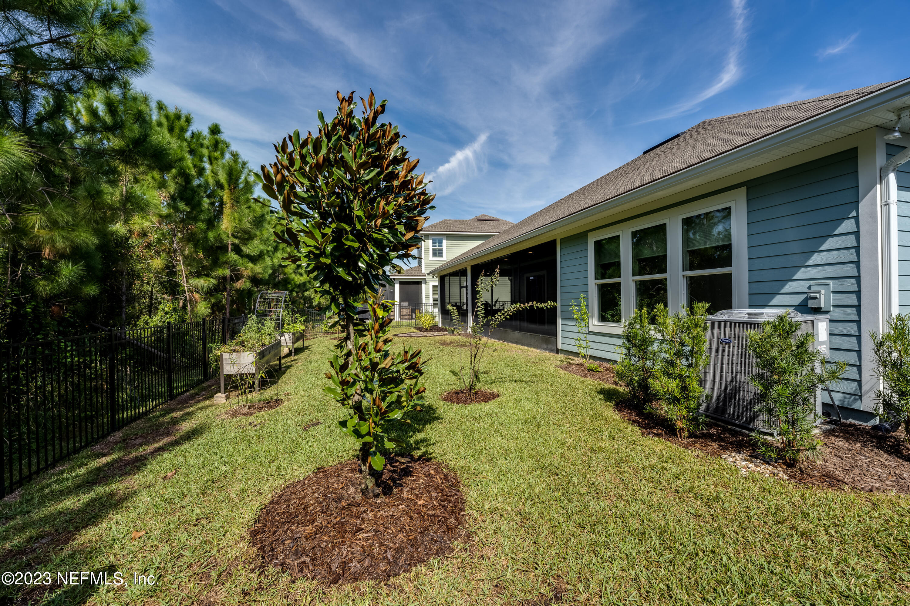 257 Glenneyre Circle St. Augustine, FL 32092 - Photo 52 of 98 a front view of a house with garden