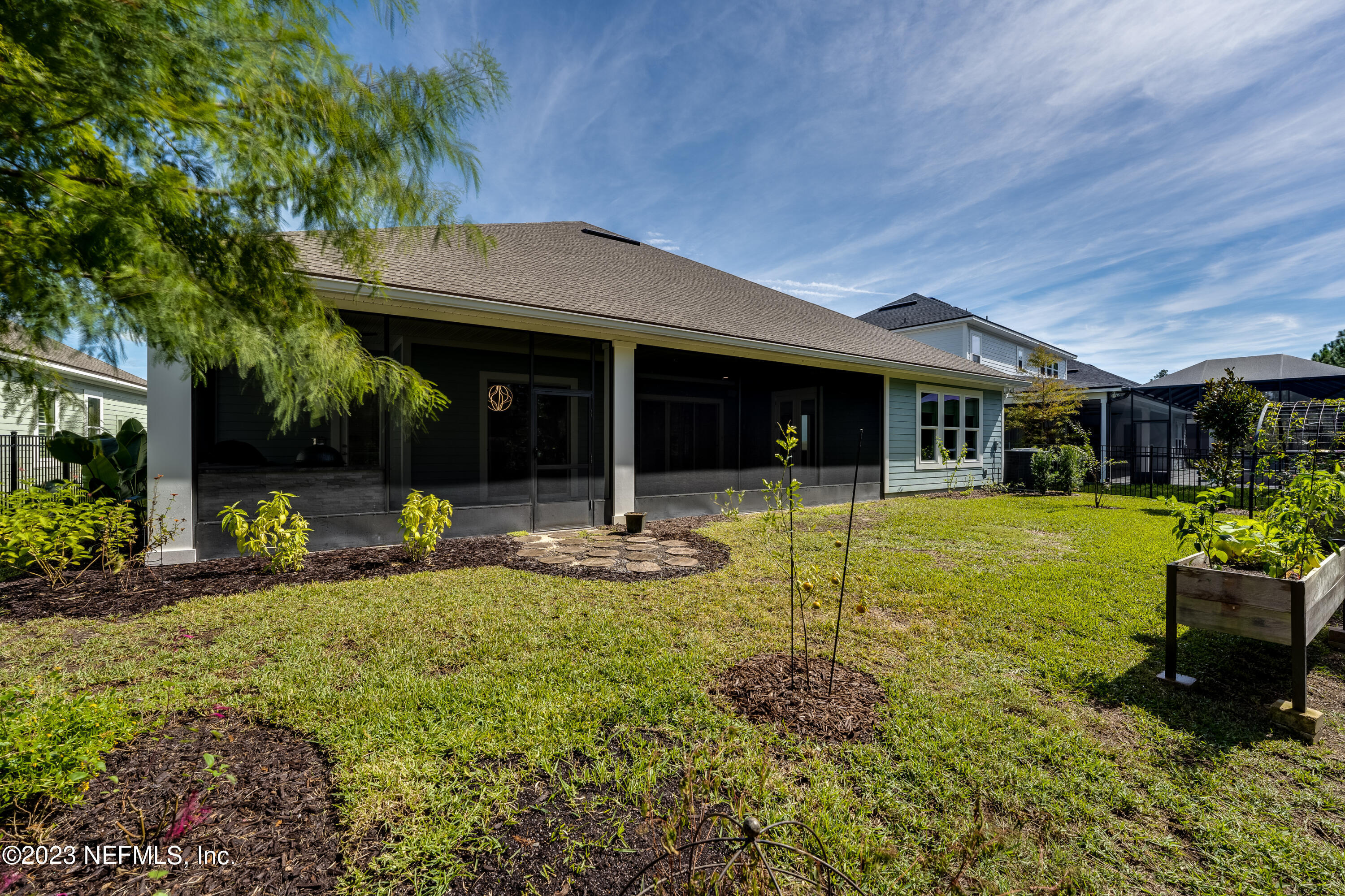 257 Glenneyre Circle St. Augustine, FL 32092 - Photo 54 of 98 a front view of a house with garden