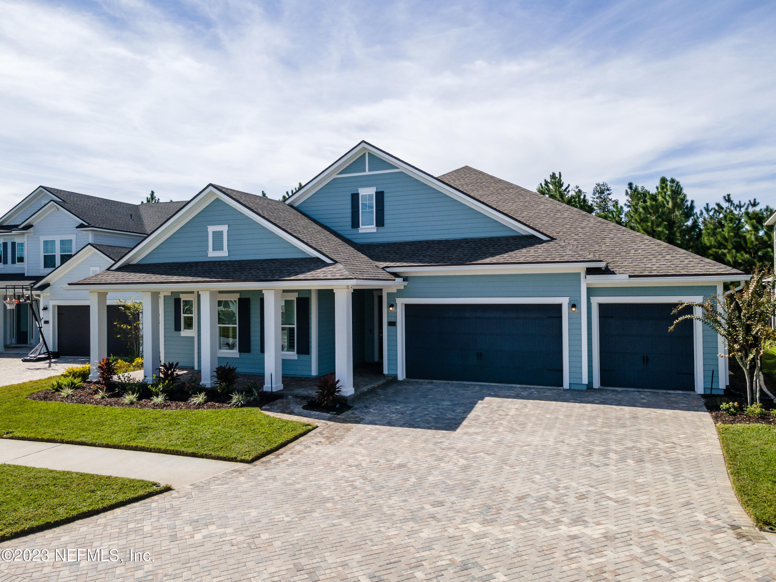 257 Glenneyre Circle St. Augustine, FL 32092 - Photo 55 of 98 a front view of a house with a yard and garage