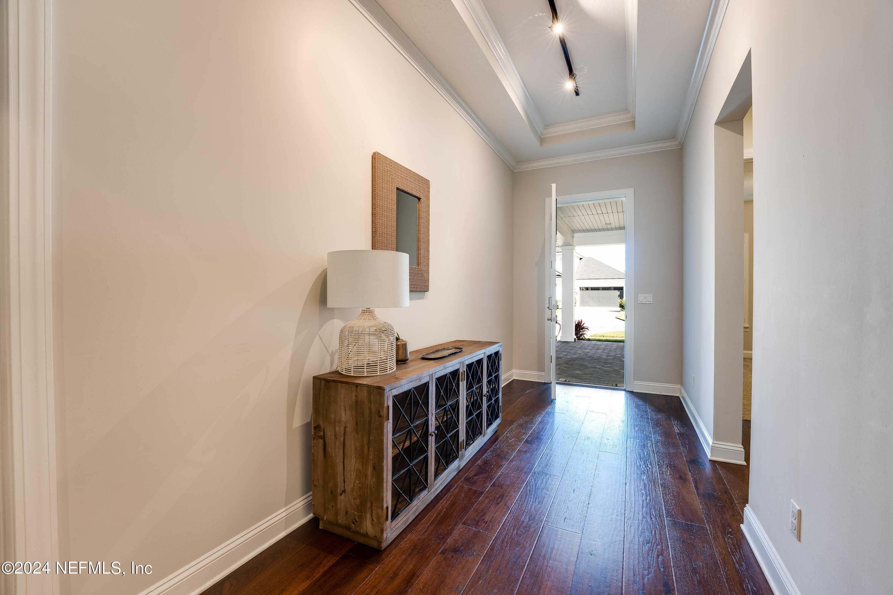 257 Glenneyre Circle St. Augustine, FL 32092 - Photo 9 of 98 a view of a hallway with wooden floor
