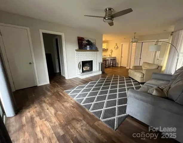 a view of a livingroom with furniture and a fireplace