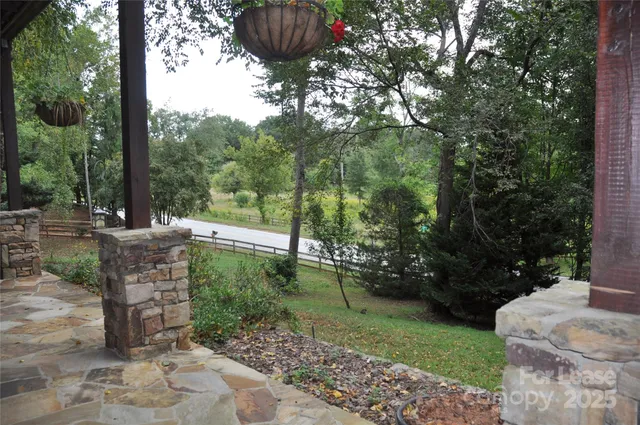 a view of a chairs and table in the garden