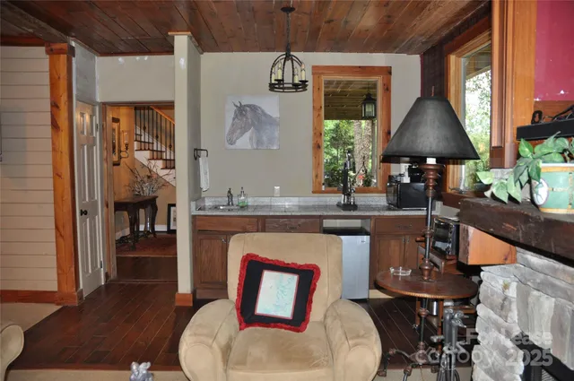 a living room with furniture a window and a table