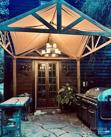 a view of a chairs and table in a patio