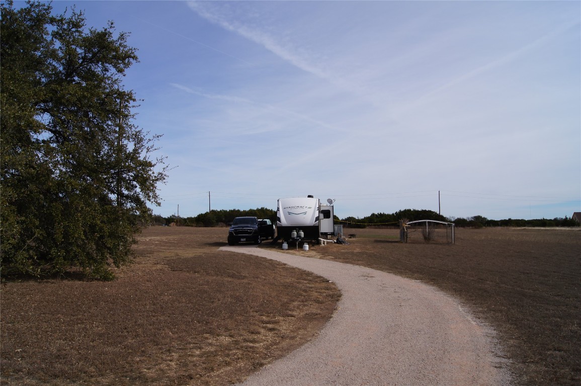 1320 County Road 304 Bertram, TX 78605 - Photo 12 of 38 a view of a lake with outdoor space