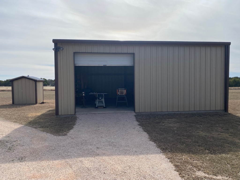 1320 County Road 304 Bertram, TX 78605 - Photo 19 of 38 a view of a room with a fireplace and cabinets