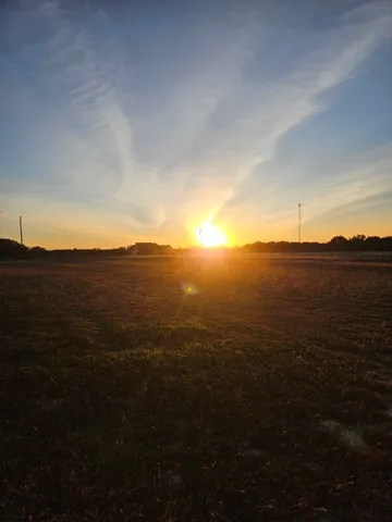 a view of ocean with sunset