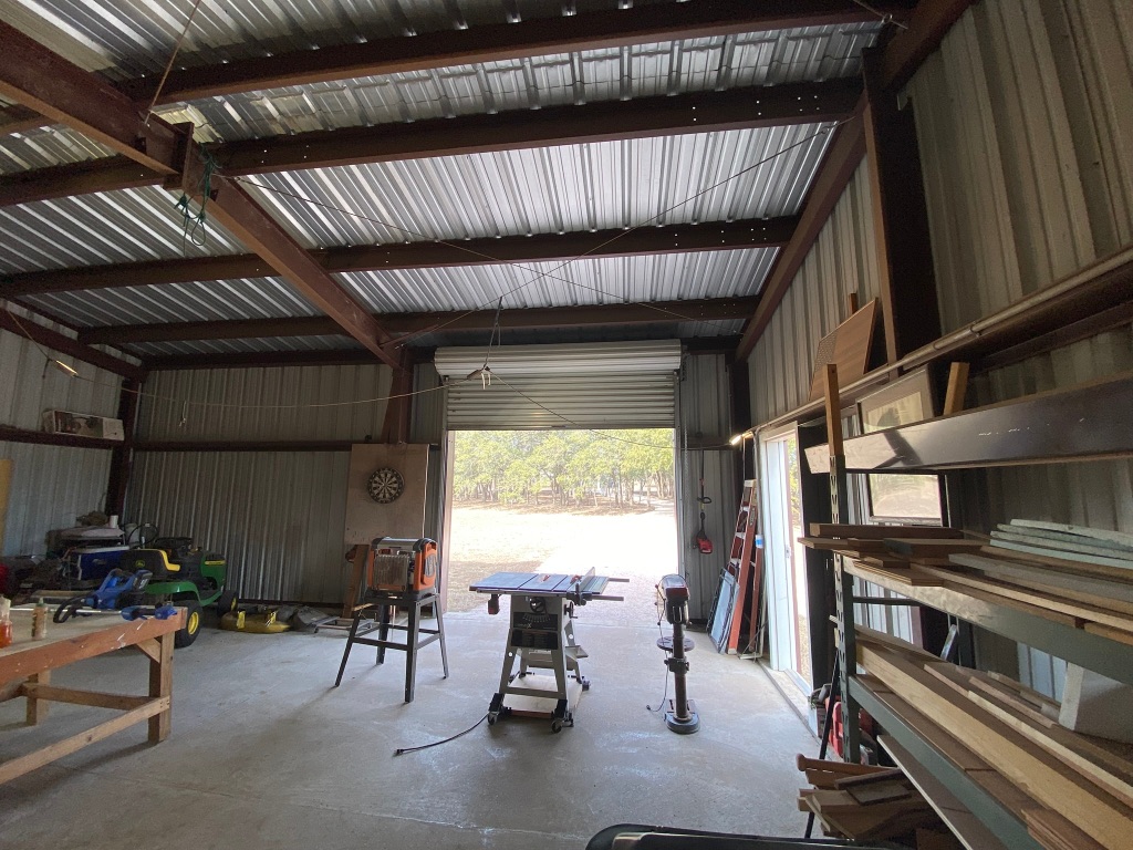 1320 County Road 304 Bertram, TX 78605 - Photo 22 of 38 a dining room with furniture and a window