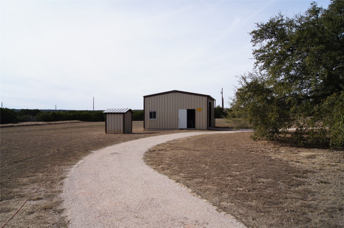 1320 County Road 304 Bertram, TX 78605 - Photo 28 of 38 a house with river in front of it