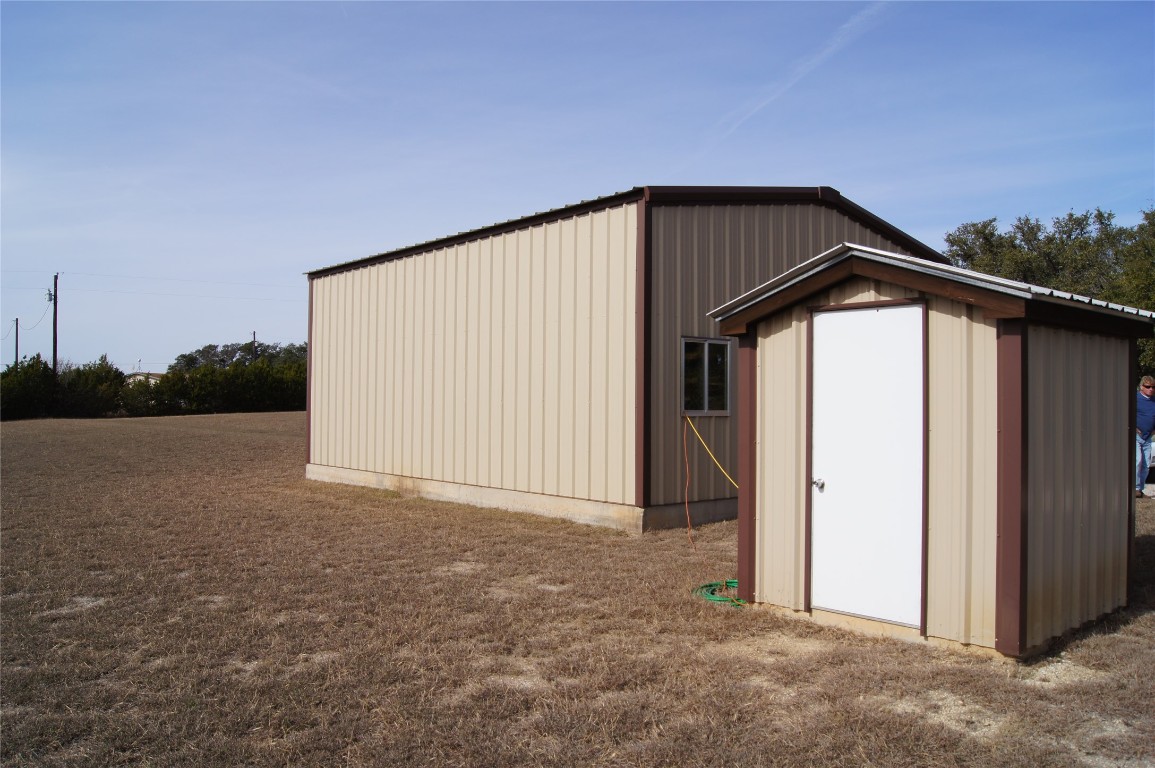1320 County Road 304 Bertram, TX 78605 - Photo 32 of 38 a view of a house with backyard and backyard