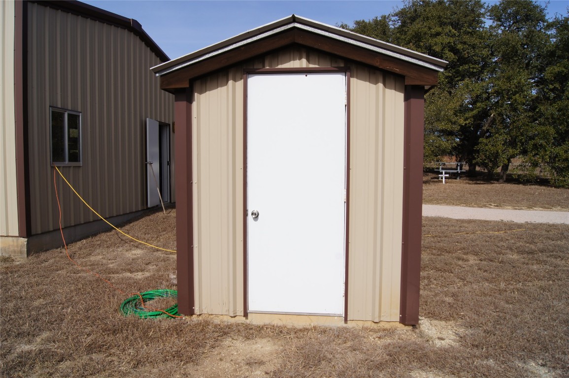 1320 County Road 304 Bertram, TX 78605 - Photo 33 of 38 a view of wooden house with a yard