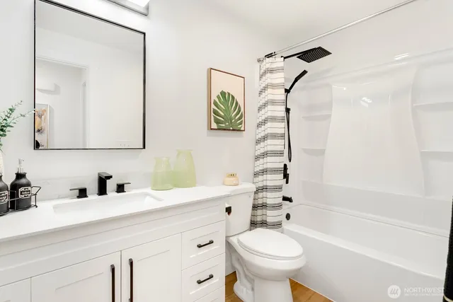 a bathroom with a sink a toilet and a bathtub