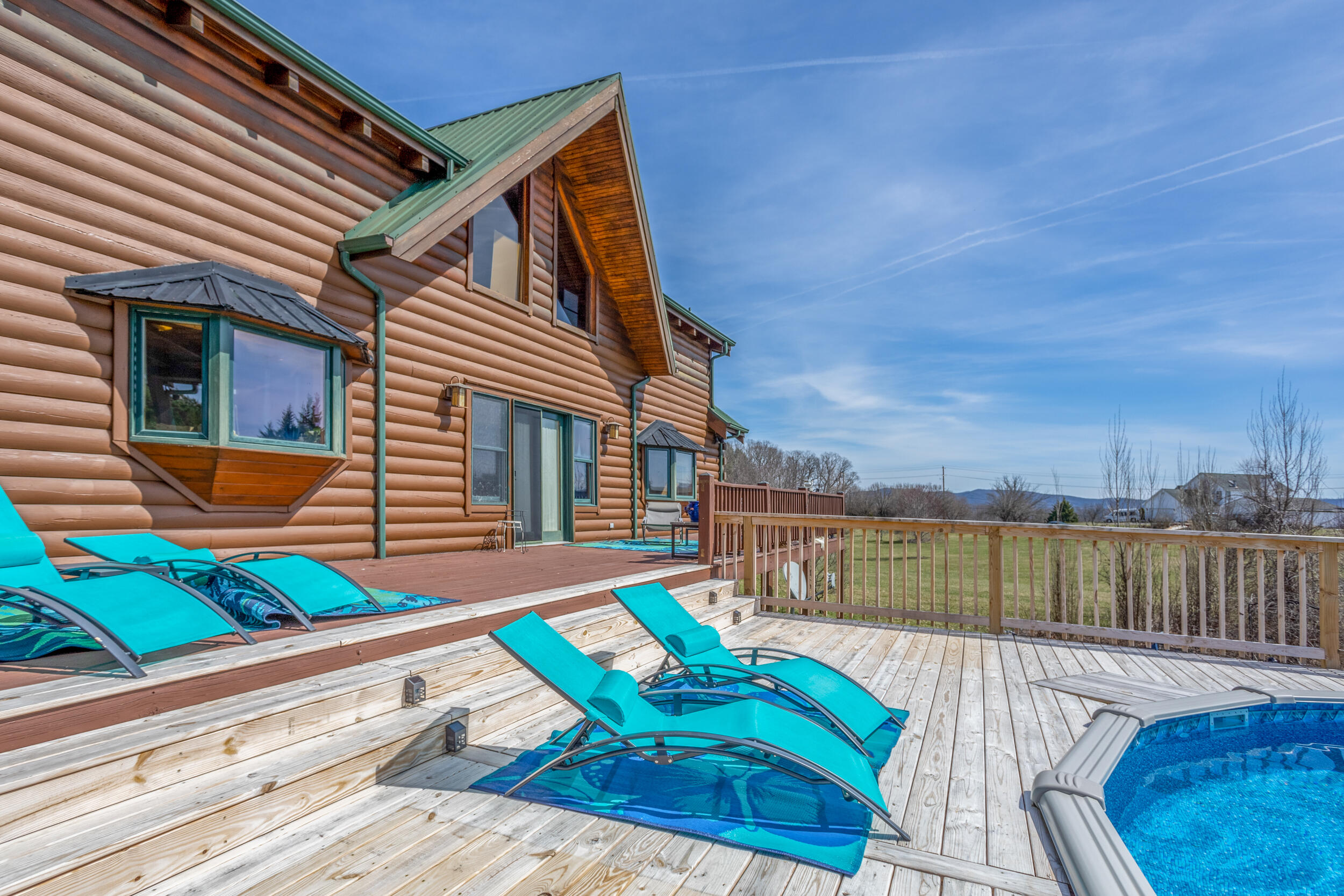 1955 Wetherburn Road Christiansburg, VA 24073 - Photo 21 of 27 a balcony with furniture and a wooden floor
