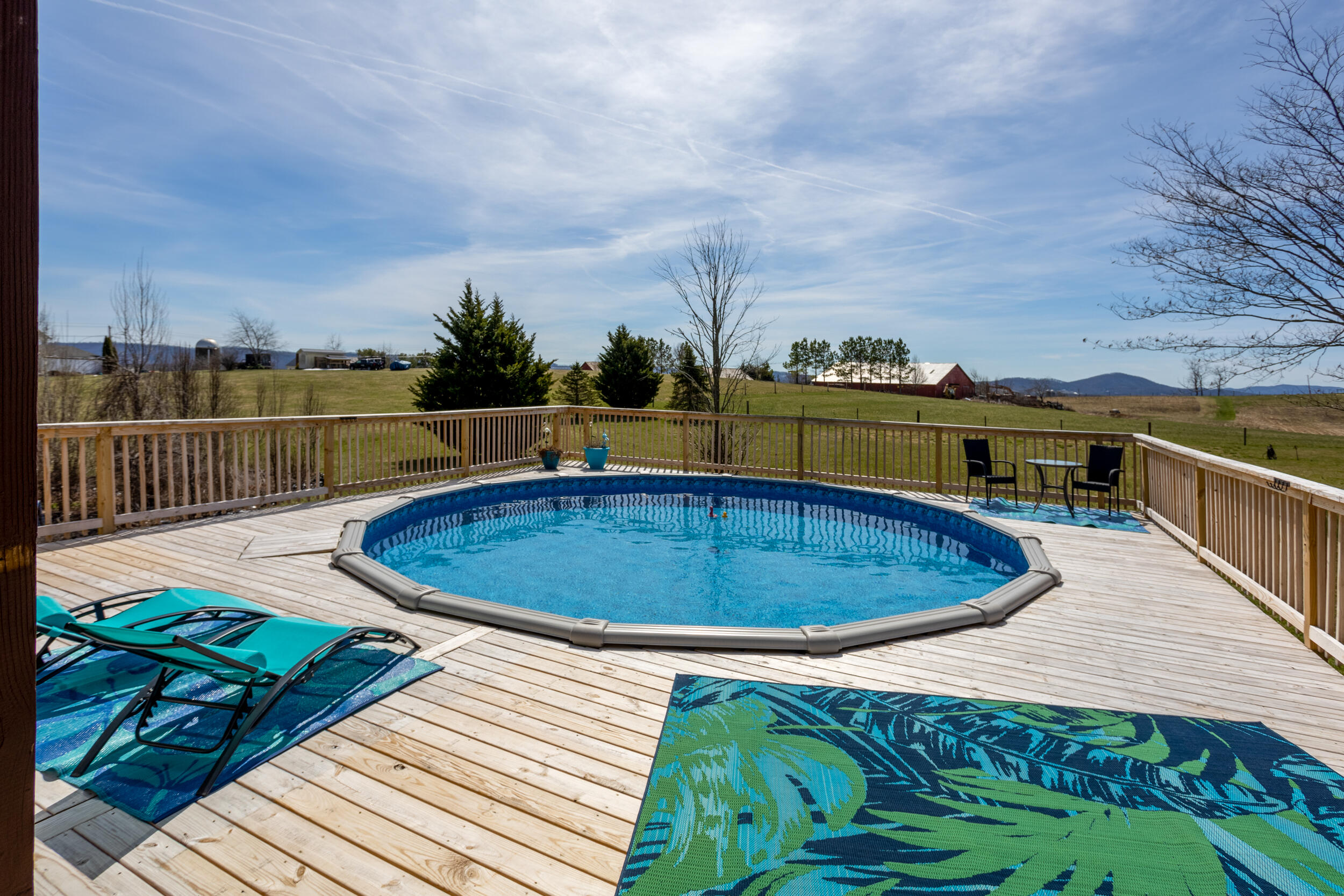 1955 Wetherburn Road Christiansburg, VA 24073 - Photo 22 of 27 a view of a swimming pool with a lounge chairs