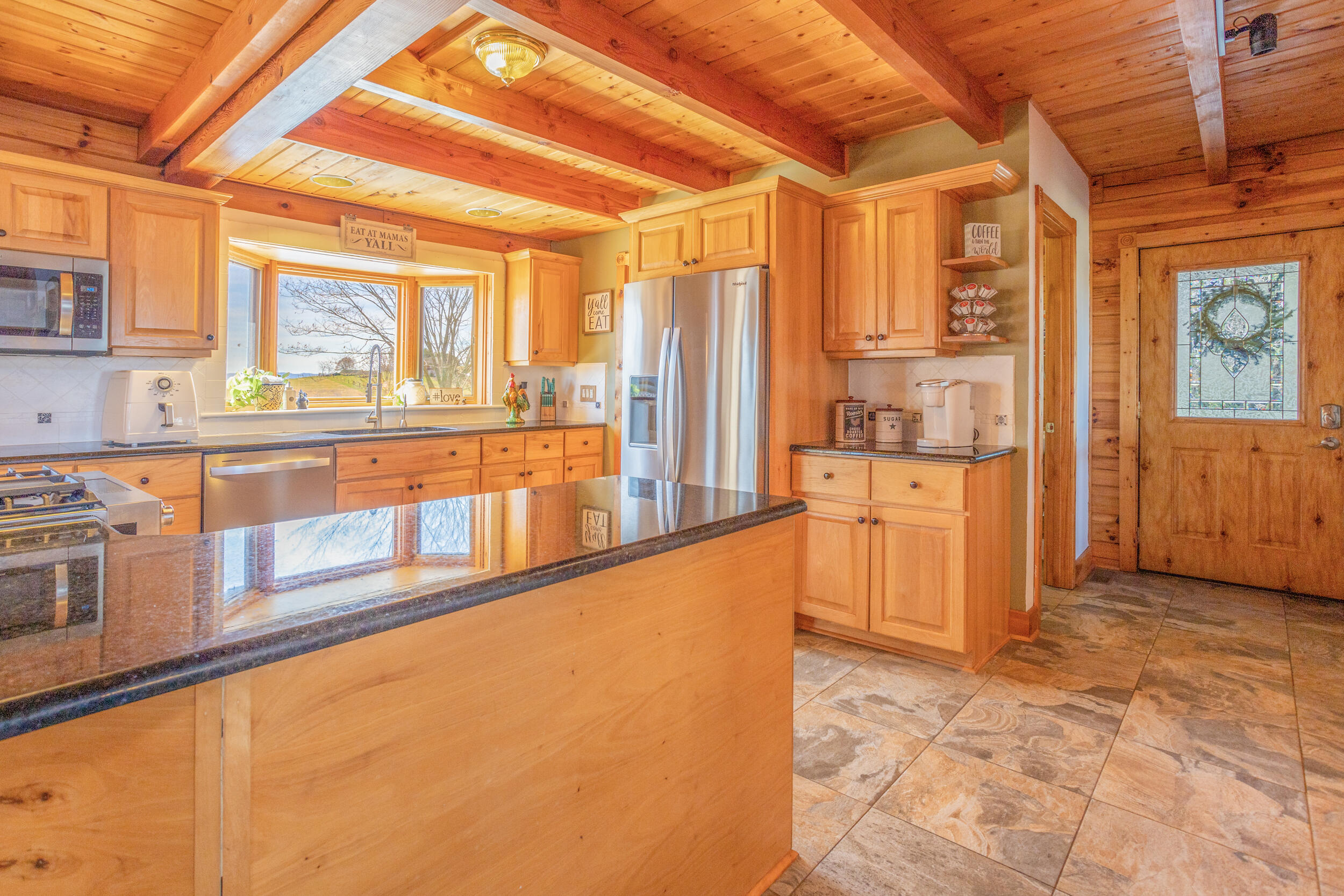 1955 Wetherburn Road Christiansburg, VA 24073 - Photo 5 of 27 a view of a kitchen with a large window