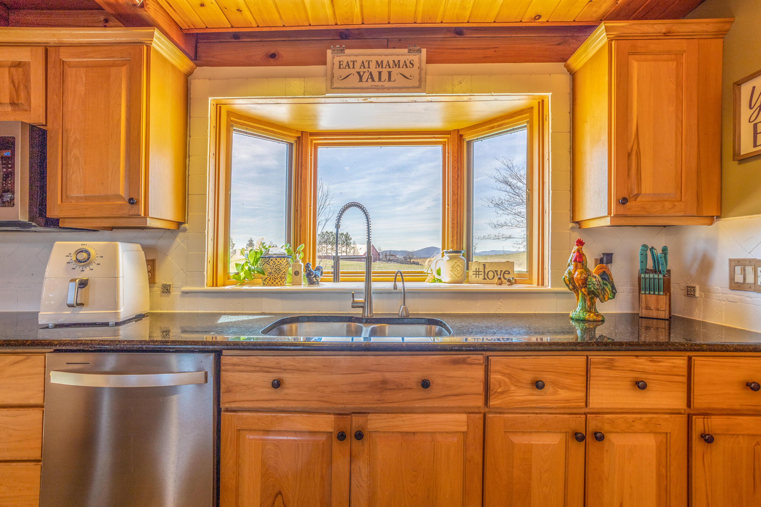 1955 Wetherburn Road Christiansburg, VA 24073 - Photo 6 of 27 a kitchen with granite countertop a sink and a window