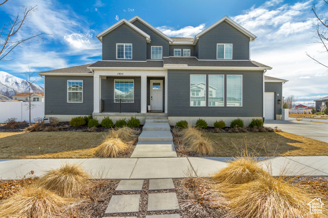 1925 Charlotte Circle Mapleton, UT 84664 - Photo 1 of 1 View of front facade featuring a garage, covered porch, and driveway