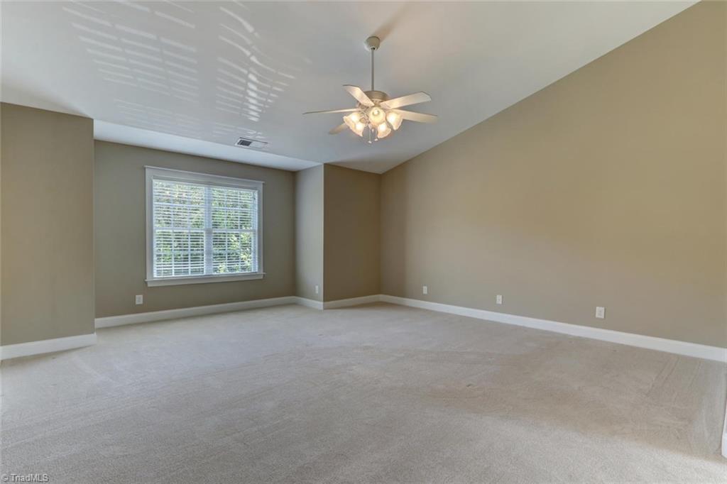 8302 Chartwell Drive Oak Ridge, NC 27310 - Photo 14 of 30 Large Master suite with high ceilings and natural light.