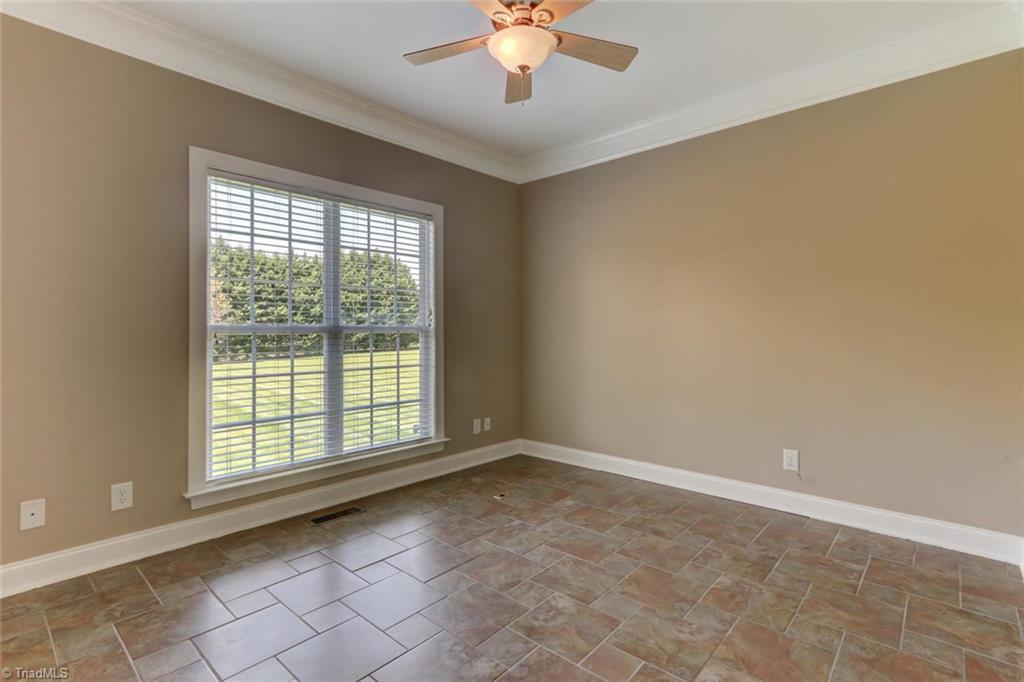 8302 Chartwell Drive Oak Ridge, NC 27310 - Photo 22 of 30 Office space with crown molding and tile.