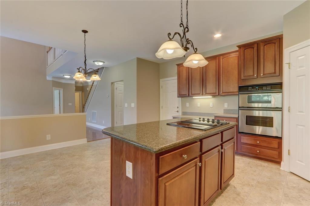 8302 Chartwell Drive Oak Ridge, NC 27310 - Photo 5 of 30 Side view of the kitchen.