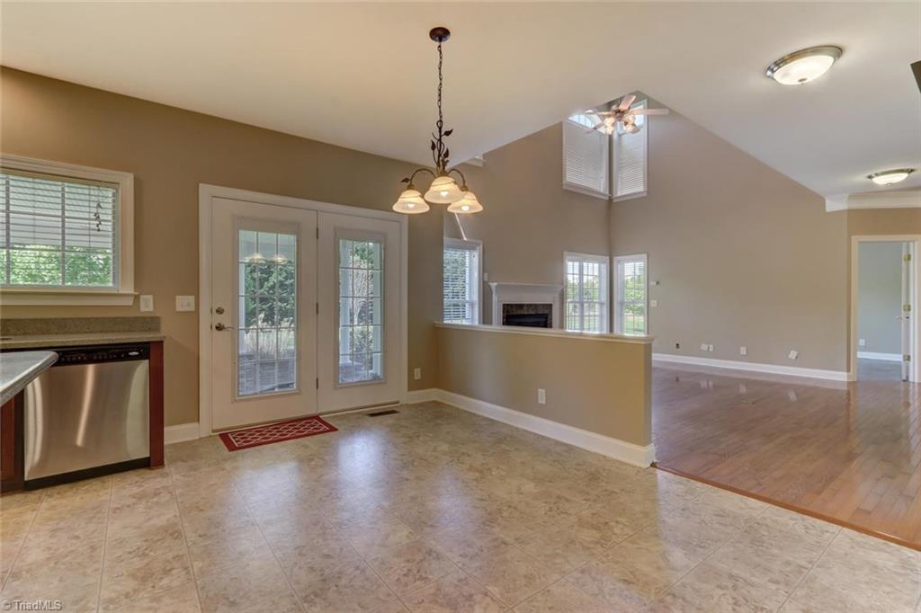 8302 Chartwell Drive Oak Ridge, NC 27310 - Photo 6 of 30 Breakfast area in the kitchen with open access to the patio.
