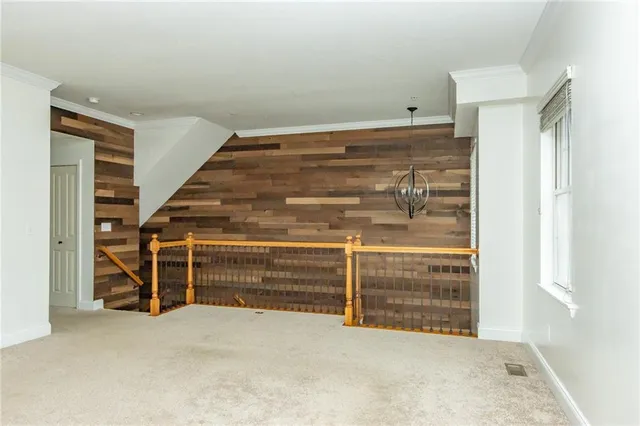 a view of an empty room with white walls