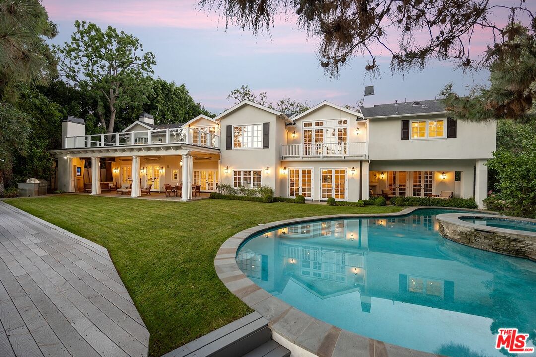 655 North Faring Road Los Angeles, CA 90077 - Photo 22 of 23 a front view of a house with garden