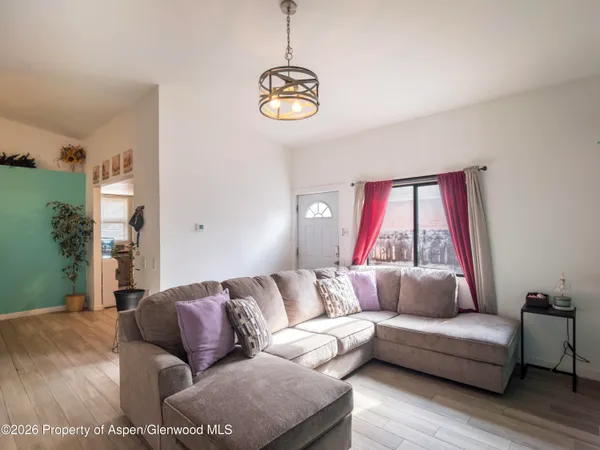 a living room with furniture and a window