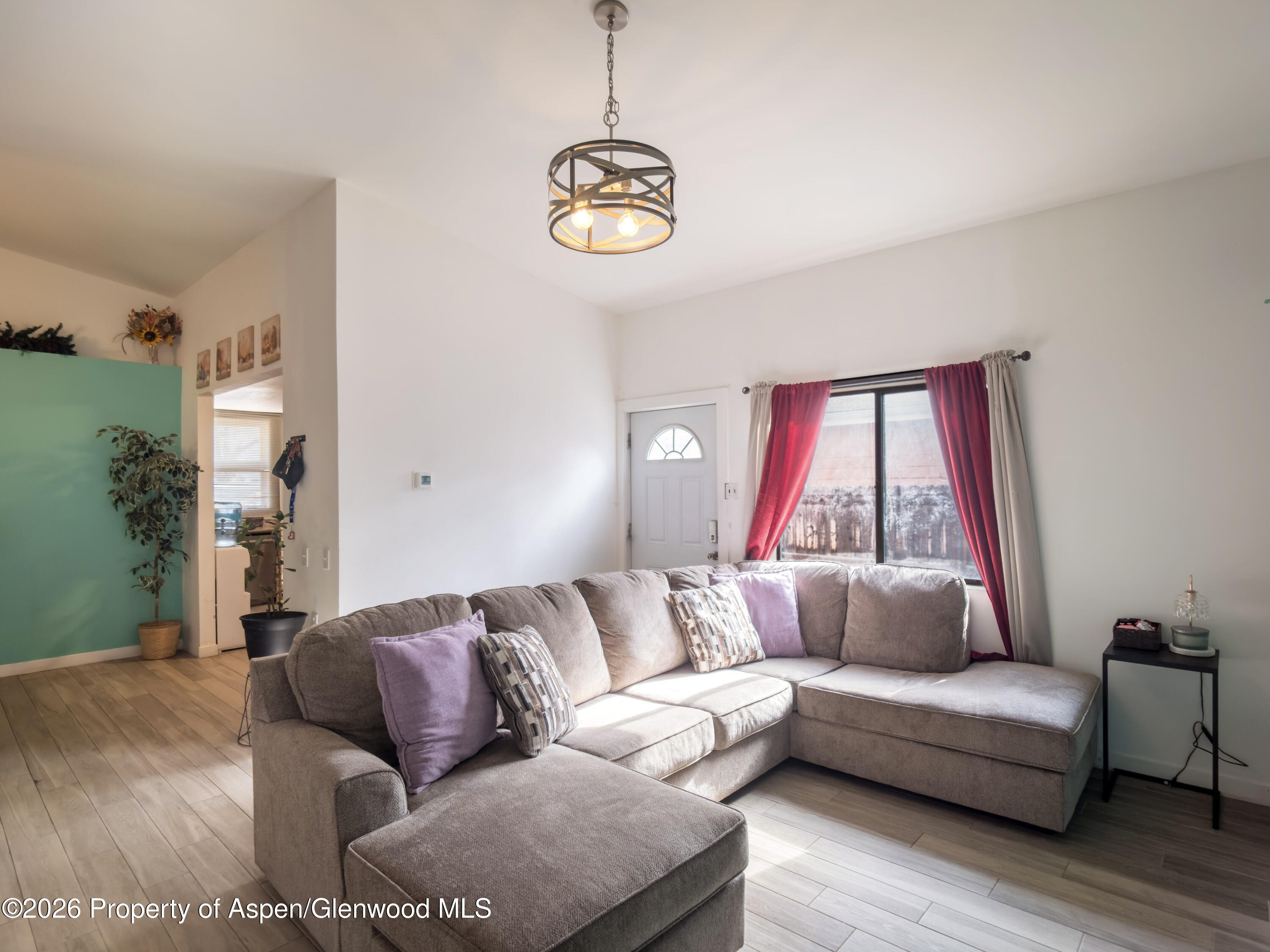 124 Daniel Avenue Rifle, CO 81650 - Photo 2 of 14 a living room with furniture and a window
