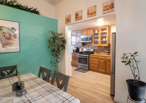 a kitchen with a table and chairs in it