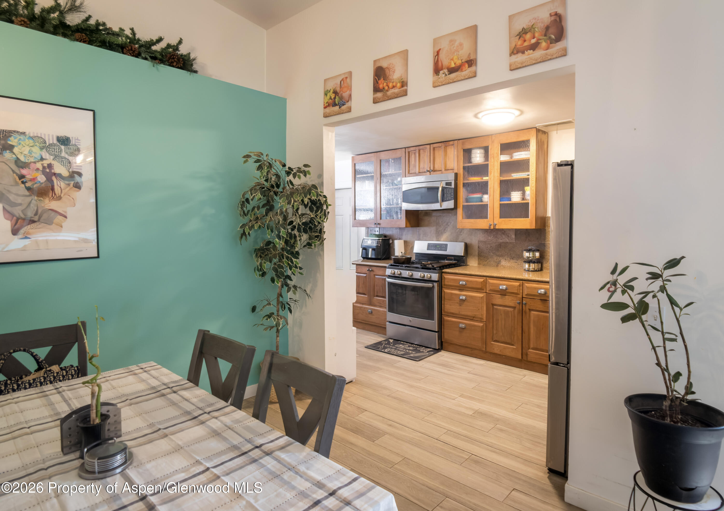 124 Daniel Avenue Rifle, CO 81650 - Photo 4 of 14 a kitchen with a table and chairs in it