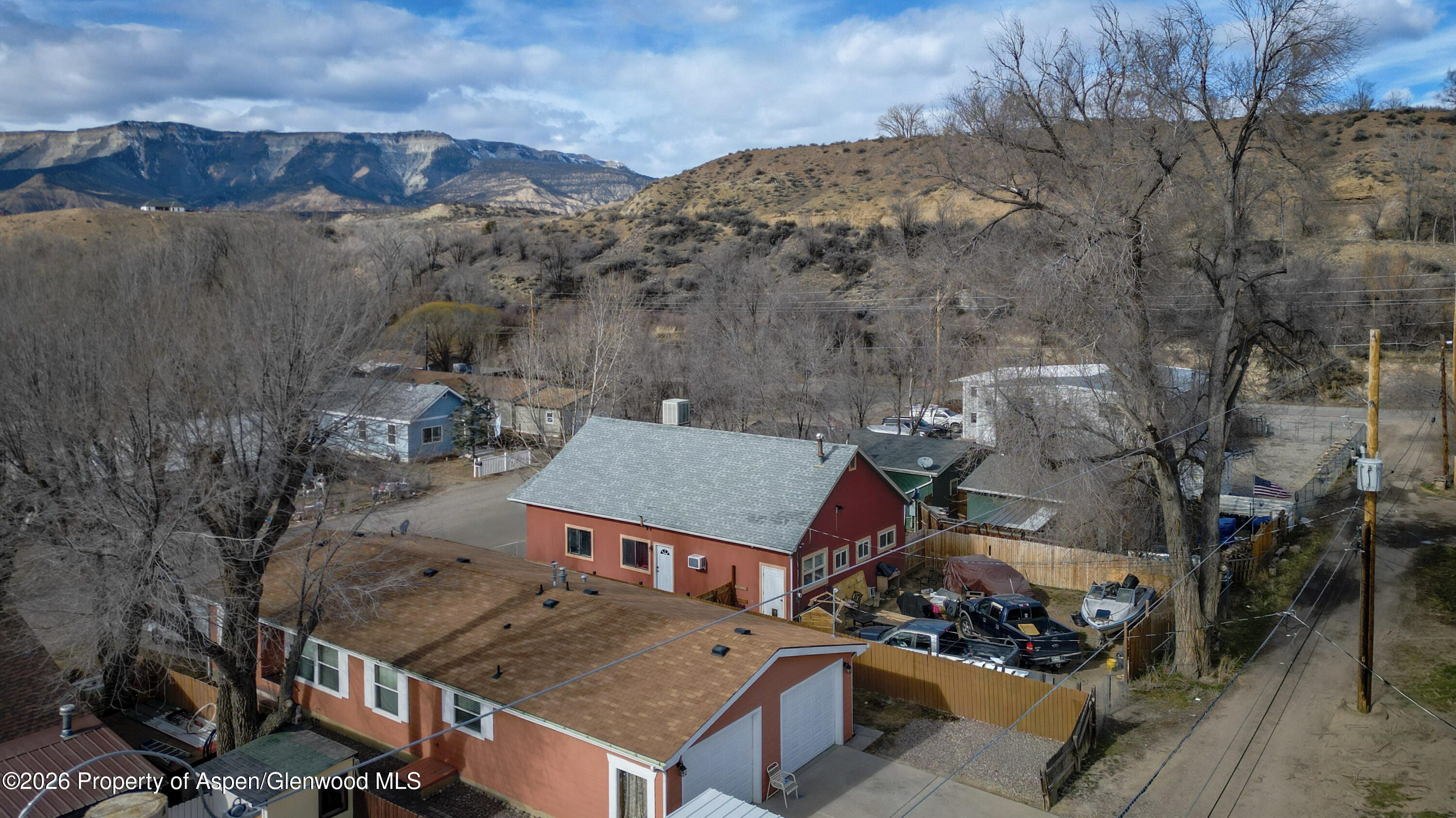 124 Daniel Avenue Rifle, CO 81650 - Photo 10 of 14 an aerial view of a house with a mountain