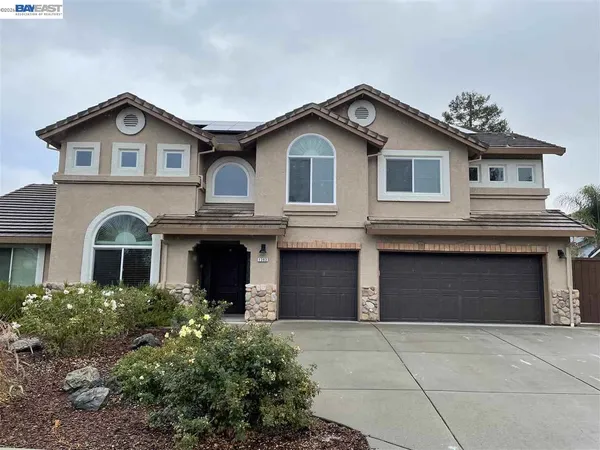 a front view of a house with a garage and garage