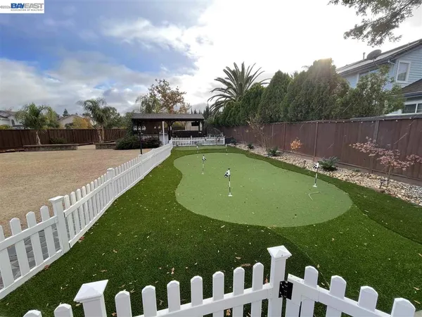 a view of a swimming pool with a garden