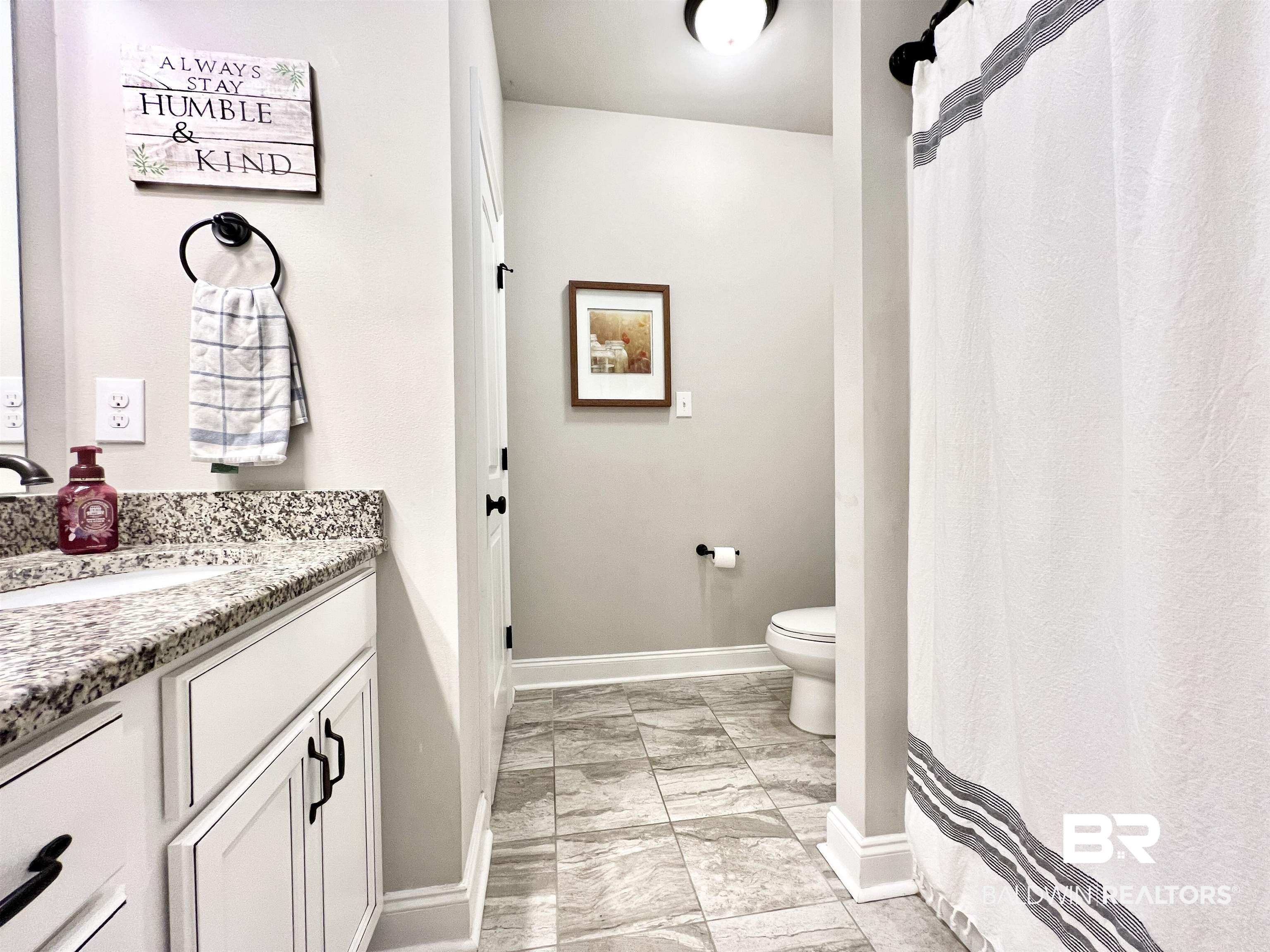 32290 Calder Court Daphne, AL 36527 - Photo 31 of 59 Bathroom with vanity and toilet