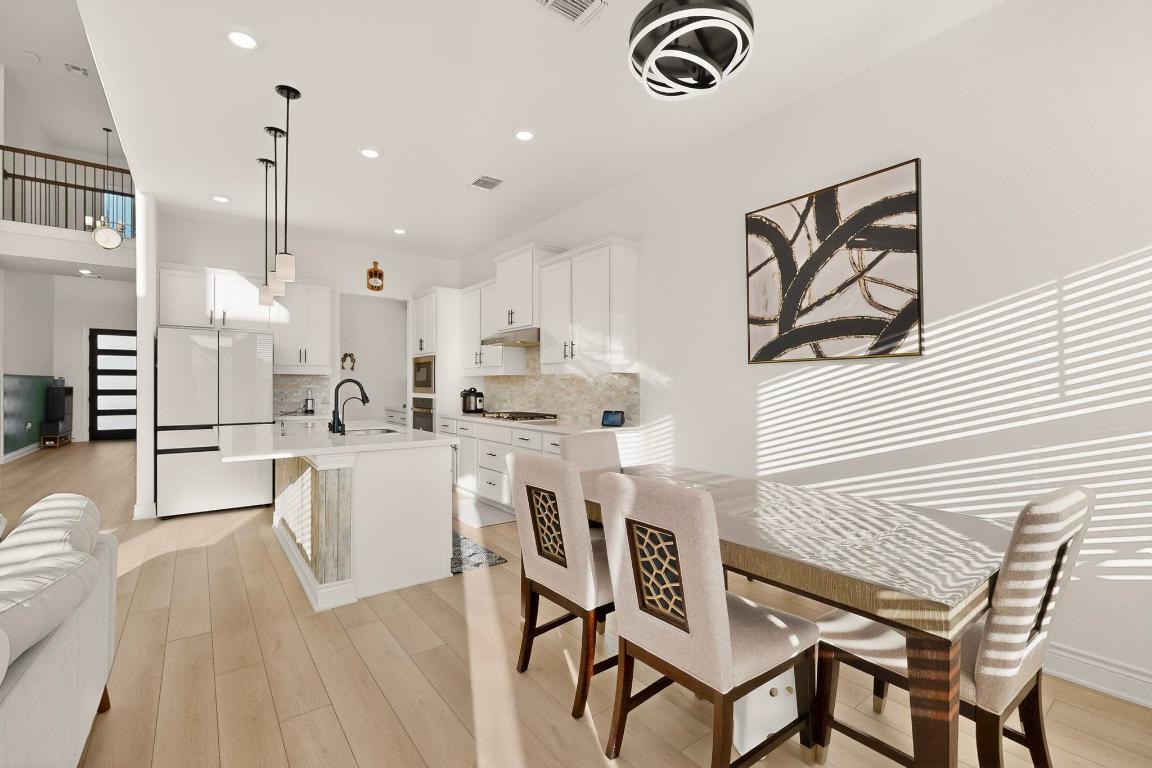 2121 Lolo Lane Leander, TX 78641 - Photo 6 of 26 Dining space with light wood finished floors and recessed lighting
