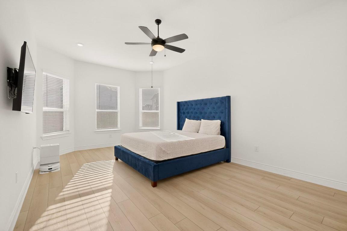 2121 Lolo Lane Leander, TX 78641 - Photo 10 of 26 Bedroom with a ceiling fan and light wood finished floors