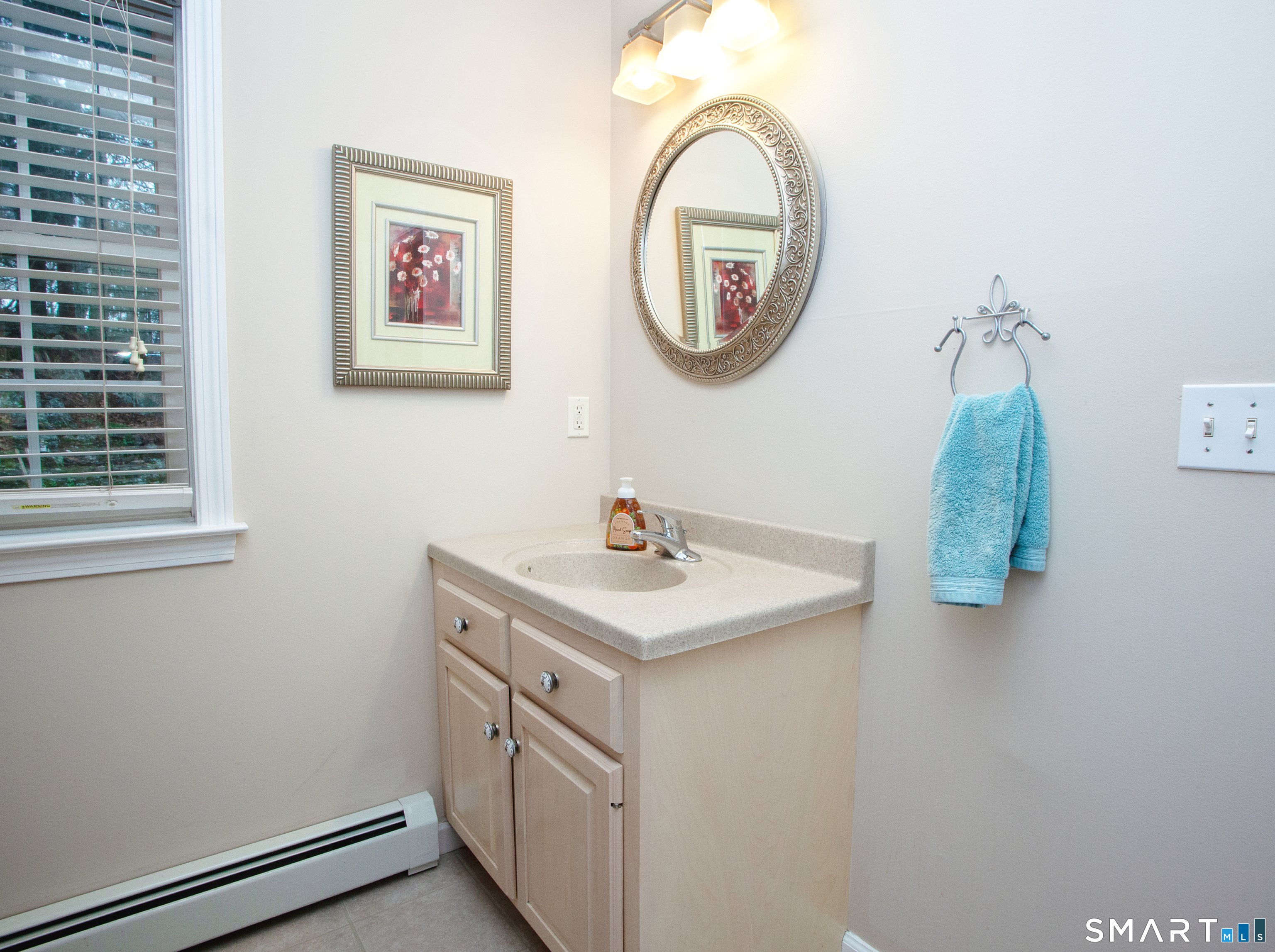 15 Rockledge Lane Canton, CT 06019 - Photo 12 of 30 a bathroom with a sink and a mirror