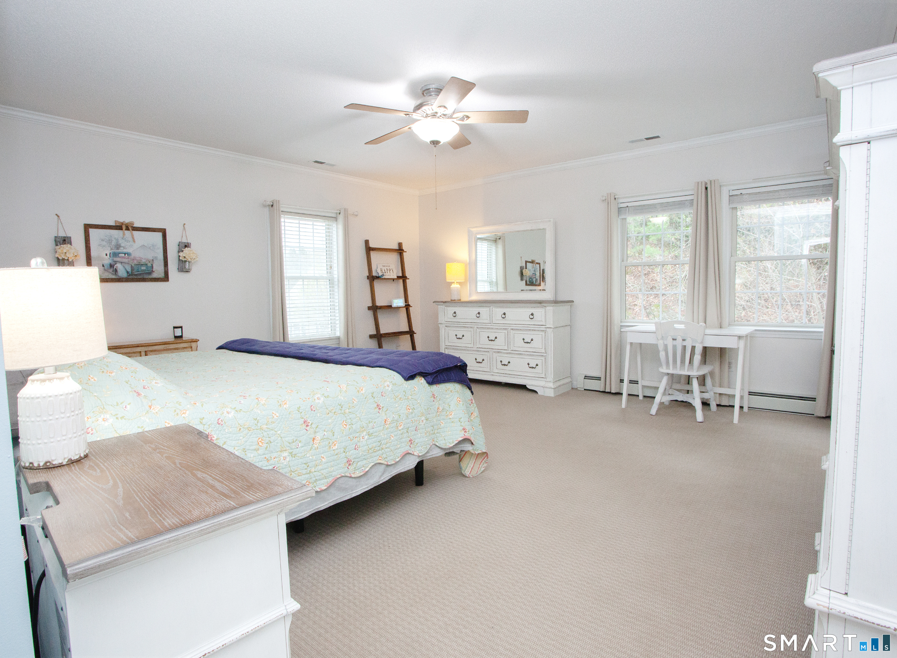 15 Rockledge Lane Canton, CT 06019 - Photo 15 of 30 a bedroom with a bed and a chandelier