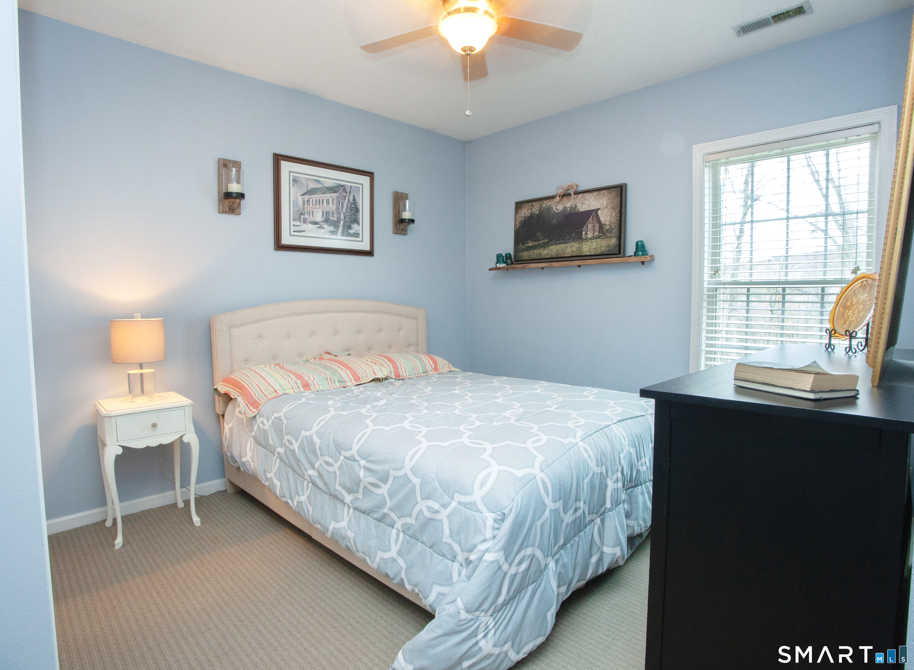 15 Rockledge Lane Canton, CT 06019 - Photo 17 of 30 a bedroom with a bed and a chandelier