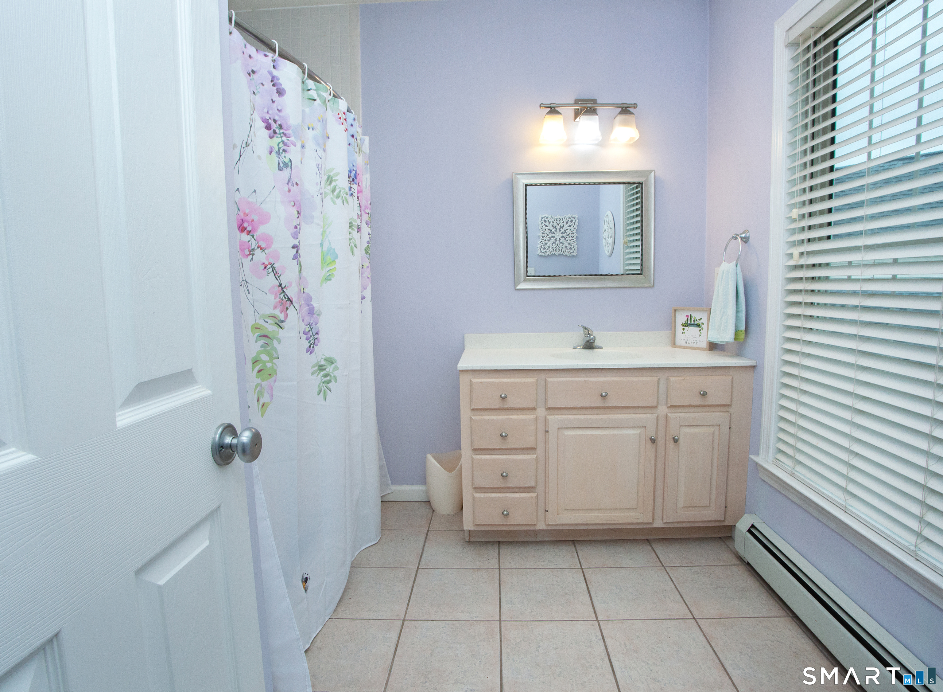 15 Rockledge Lane Canton, CT 06019 - Photo 21 of 30 a bathroom with a sink a vanity and a mirror