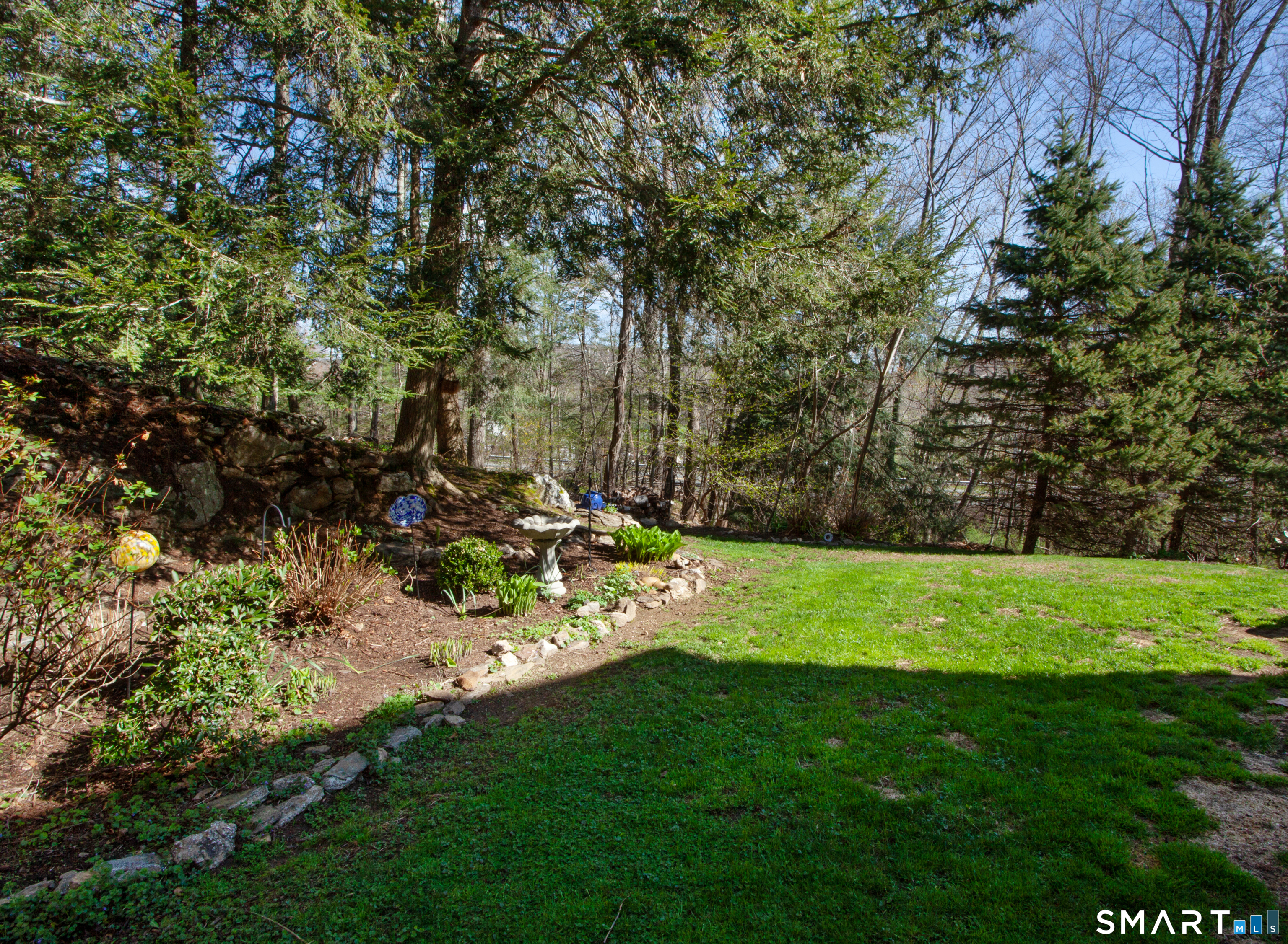 15 Rockledge Lane Canton, CT 06019 - Photo 24 of 30 a view of a backyard with large trees