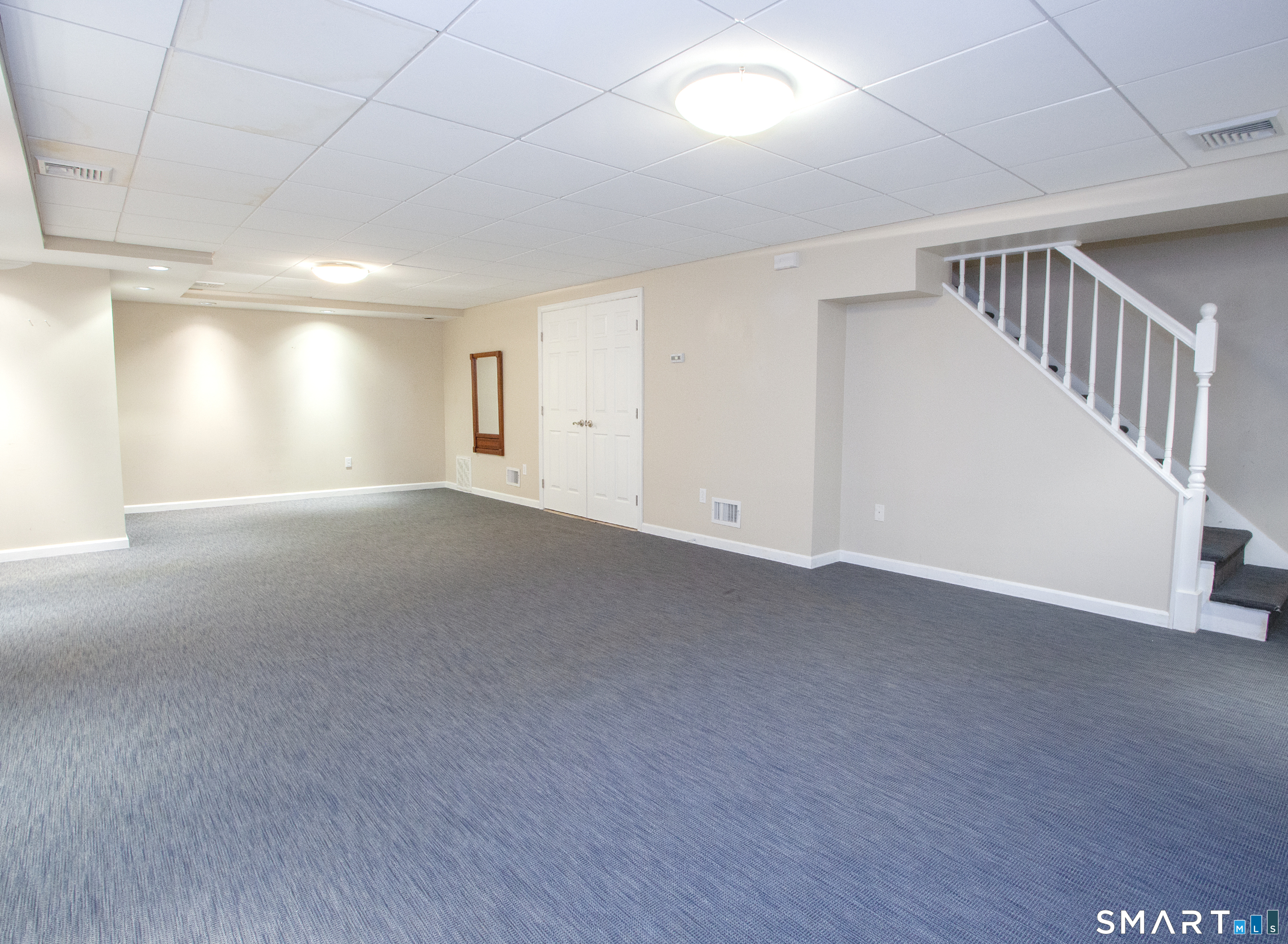 15 Rockledge Lane Canton, CT 06019 - Photo 26 of 30 a view of an empty room with stairs and a window